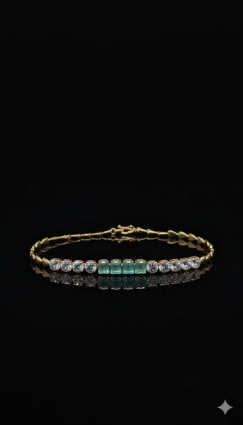 Gold Bracelet Adorned With Emerald Stones